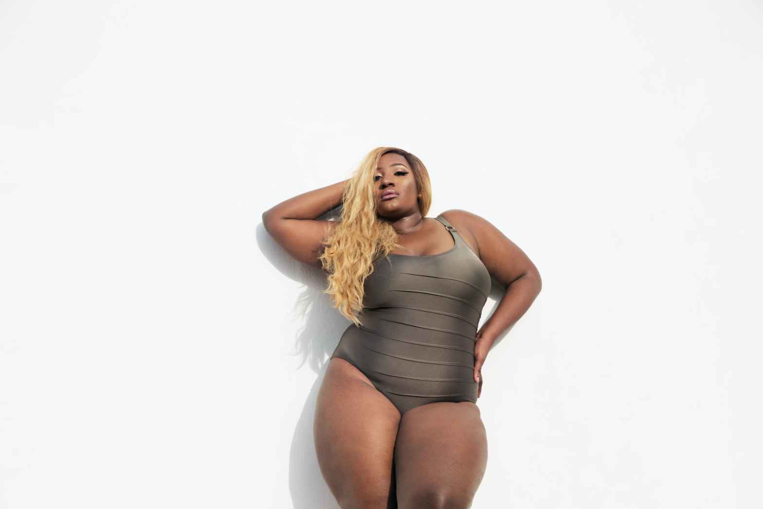 black woman in one piece swimsuit